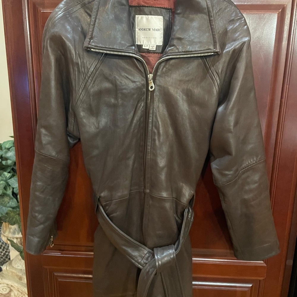 Woman’s Andrew Marc belted leather jacket.